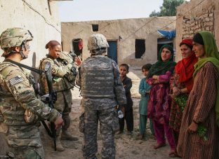 KANDAHAR CITY, Afghanistan (Aug. 4) – Spc. Christina Alvarado and Sgt. Shanequa Cardona, members of the Female Engagement Team with Headquarters and Headquarters Company, 2nd Battalion, 8th Infantry Regiment, 2nd Brigade Combat Team, 4th Infantry Division, talk to some local women with the help of their interpreter Hayda Azizi, in sub district 6, Aug. 4. “The women have a lot of concerns about their children’s education and medical needs,” Alvarado said.  (U.S. Army photo by Sgt. Ruth Pagan, 2nd Brigade Combat Team, 4th Infantry Division PAO)